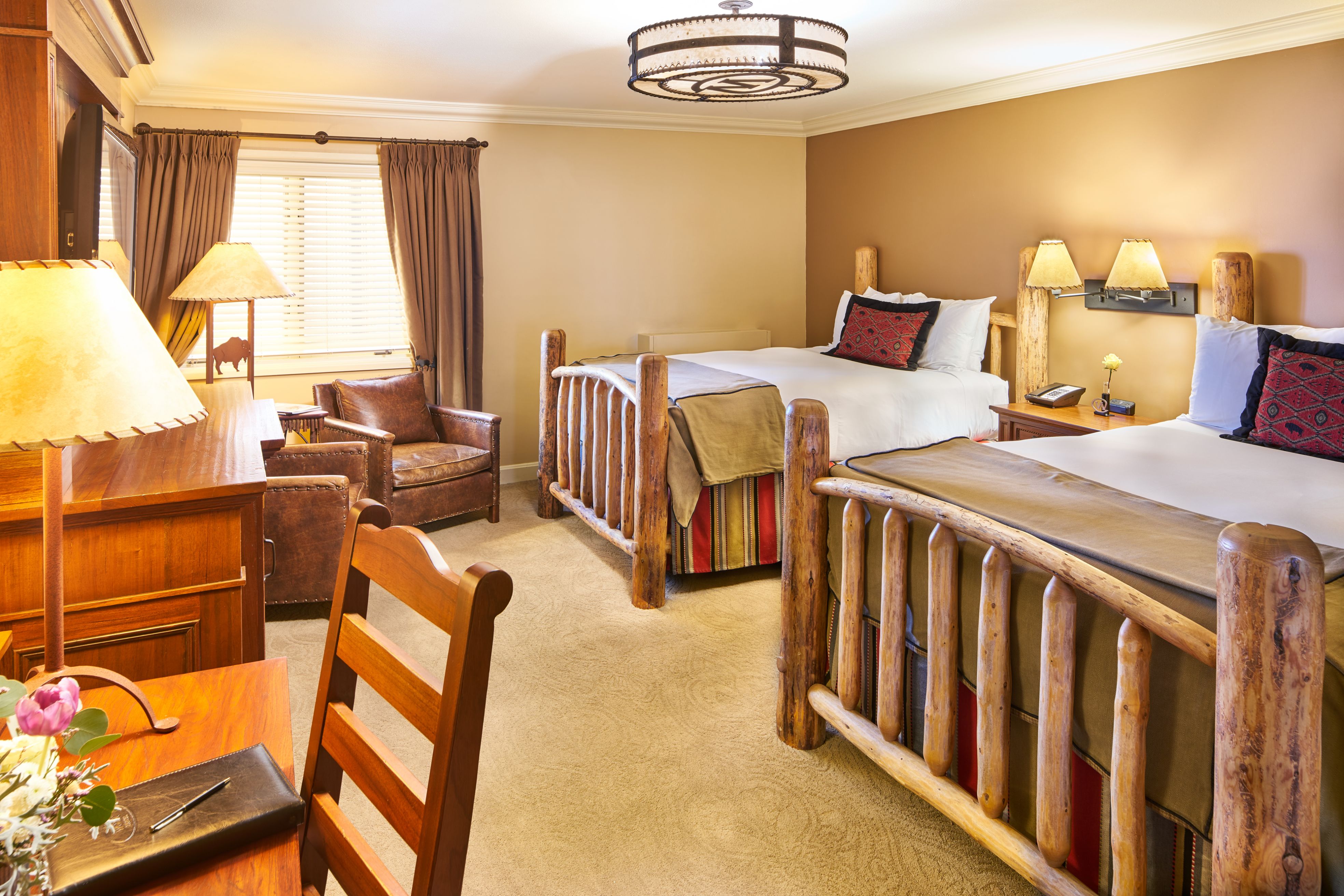 Image of a Deluxe Room with two queen beds at The Wort Hotel, a member of Historic Hotels of America since 2002, located in Jackson Hole, Wyoming